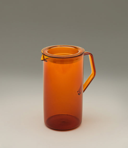 Cast Amber Jug from Kinto. The Item can hold 750ml of liquid. The modern geometric shape is a perfect companion to any kitchen.